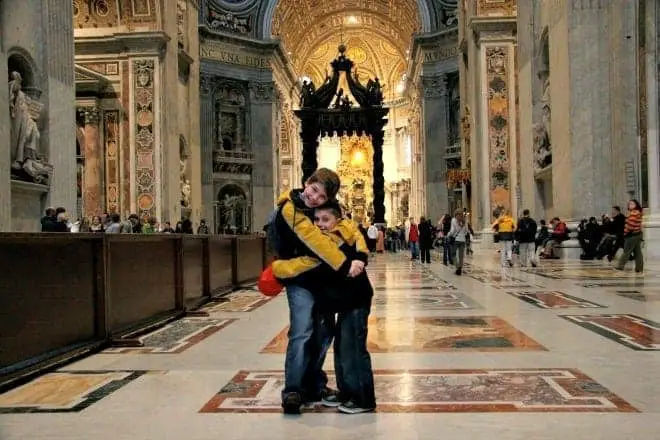 boys hugging in st peter's basilica in rome italy