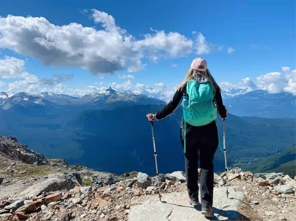 lady hiking whistler peak in summer