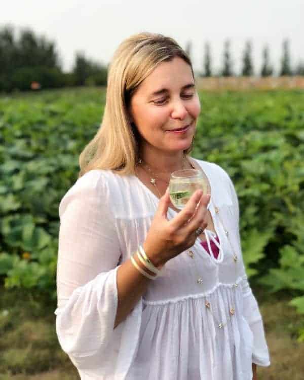 lady enjoying gin in field of cucumbers in saskatoon