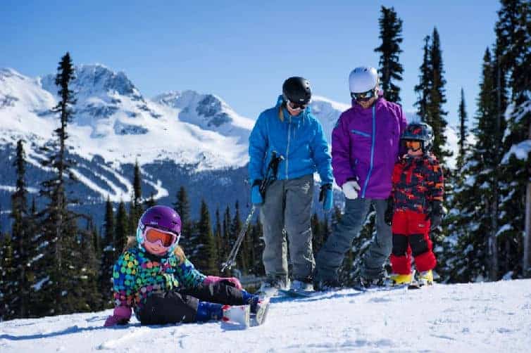 family with kids skiing at whistler