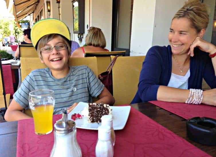 mother and son laugh over cake in germany