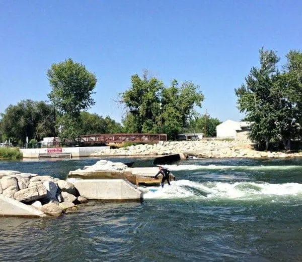 surfer riding waves on river in boise idaho