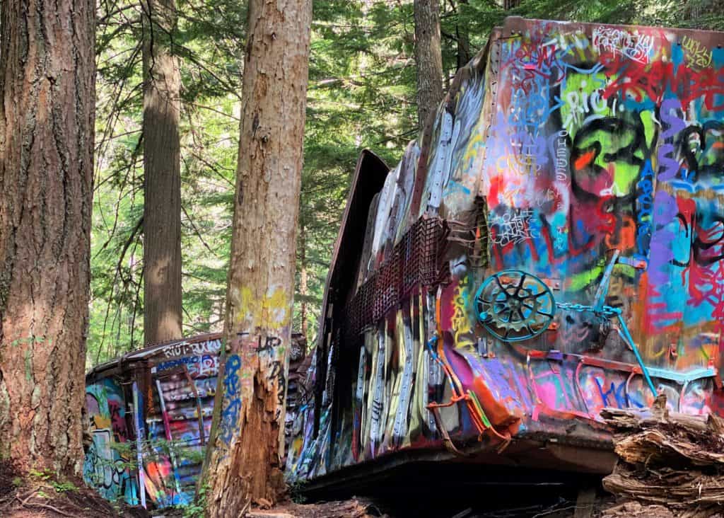 two graffiti covered train wreck whistler cars