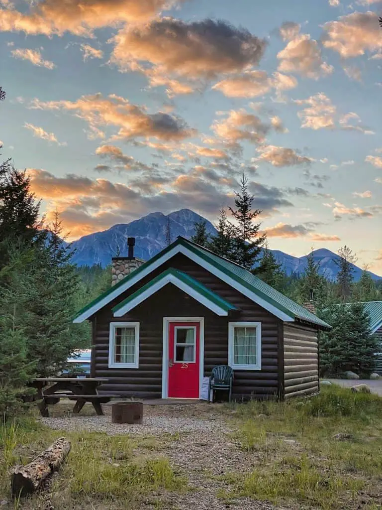 log cabin at pine bungalows at sunset