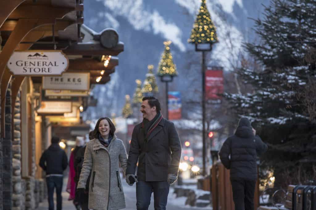 couple enjoying walk in Banff at Christmas
