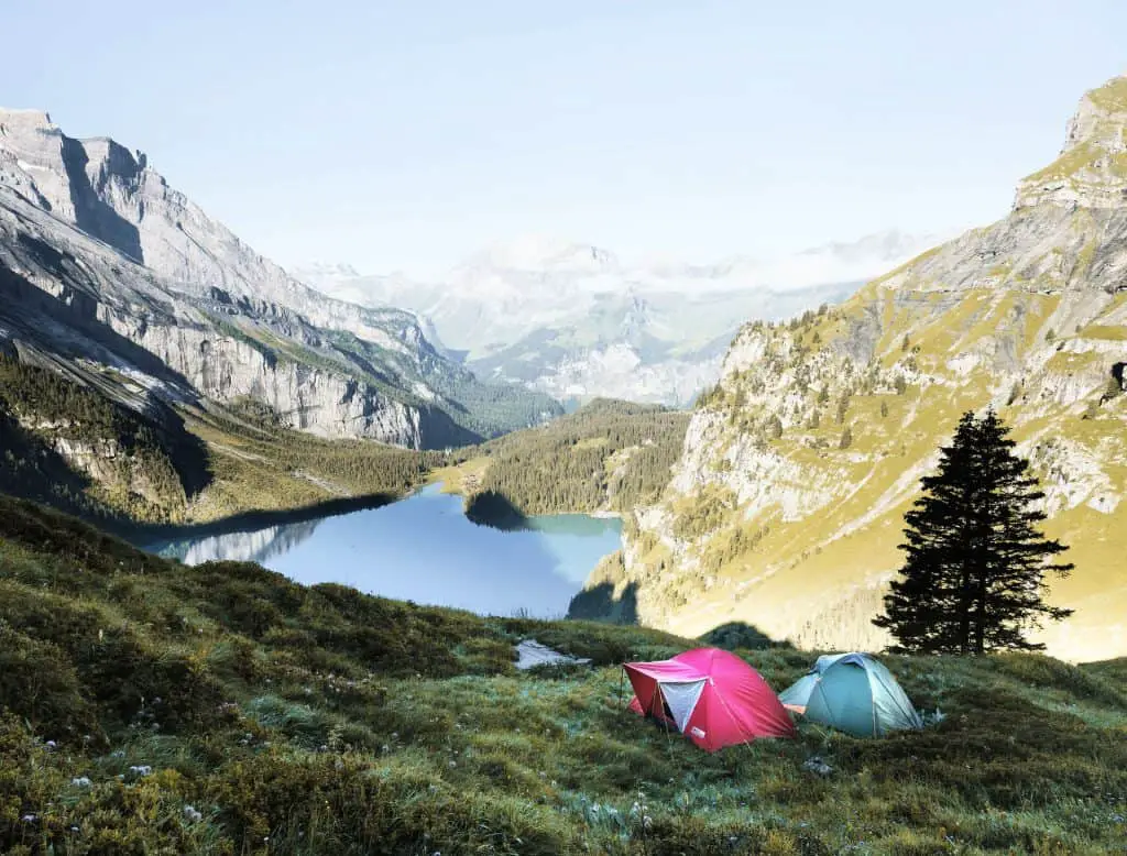 tents overlooking lake in summer