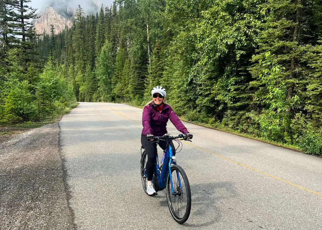 cyclist on road in yoho national park