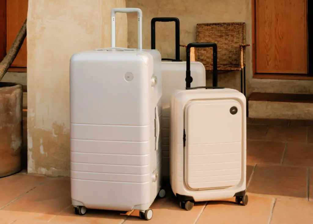 pastel monos suitcases in a group of three
