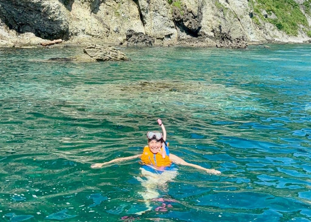 lady snorkeling off shakotan peninsula